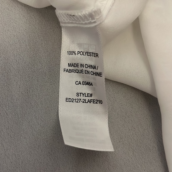 Ricki’s Asymmetrical Black and White Blouse Size Large NWT - Picture 5 of 5